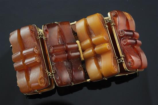 An early 20th century 9ct gold mounted amber bracelet, approximately 6in.